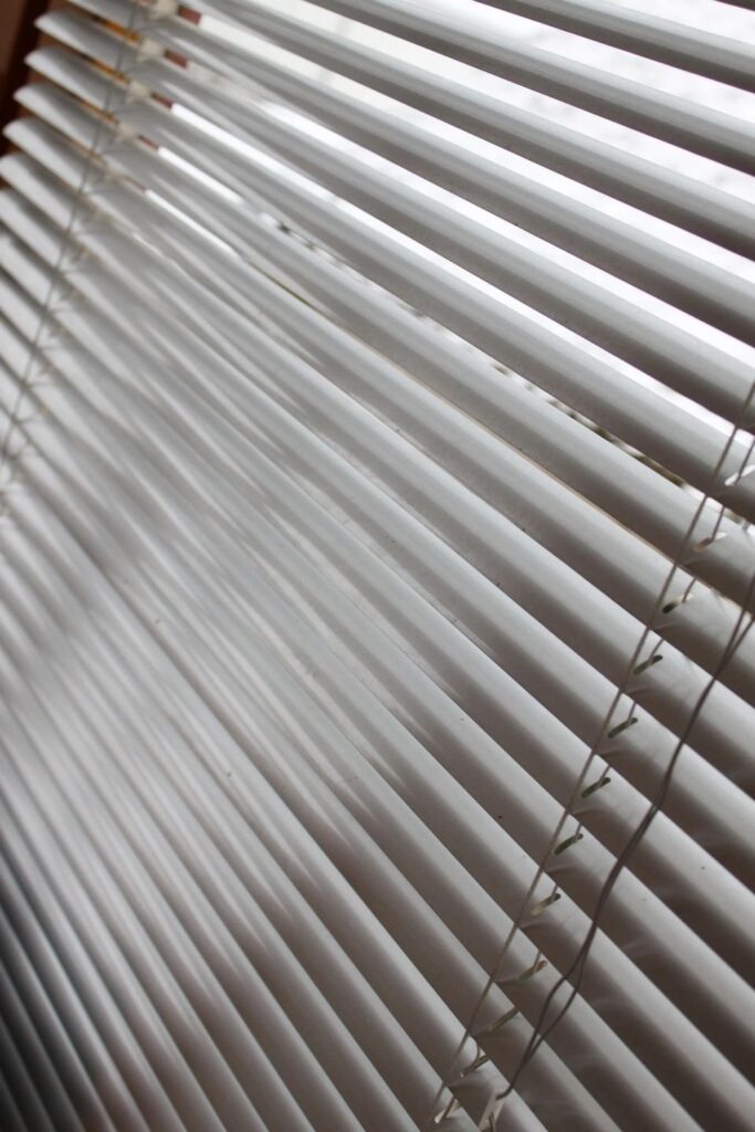 Close-up of white horizontal window slats
